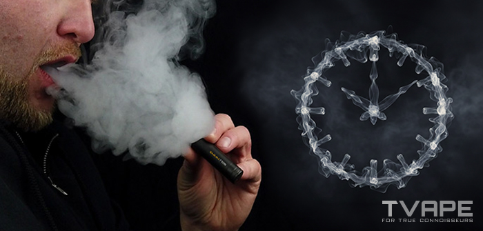 A man exhaling a large cloud of vapor from a Tronian Gammatron dab pen