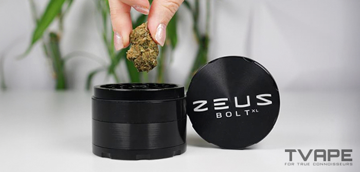 Weed strain is being placed into the Zeus Bolt XL grinder