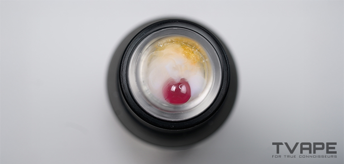 A close-up of the ruby terp pearl spinning around in a heating chamber of a dab pen