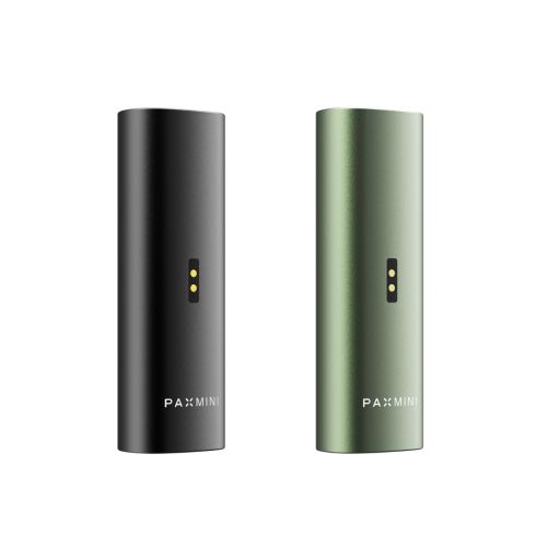 New PAX Mini vaporizers in Onyx and Greenstone colors, featuring charging ports at the back and the PAX Mini logo at the bottom of the sleek aluminum body.