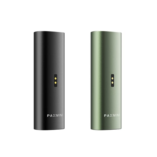 New PAX Mini vaporizers in Onyx and Greenstone colors, featuring charging ports at the back and the PAX Mini logo at the bottom of the sleek aluminum body.