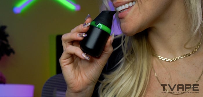 A woman is using the Puffco Proxy Core concentrate vaporizer